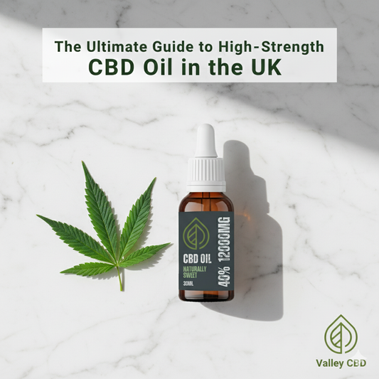 The Ultimate Guide to High-Strength CBD Oil in the UK - A feature image showing a bottle of Valley CBD 40% 12000mg Broad Spectrum CBD Oil next to a hemp leaf on a clean white marble surface.